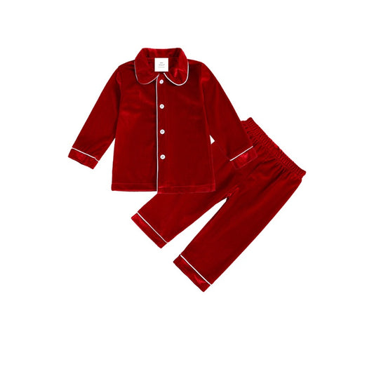 Boys’ red velvet pyjama jacket and trousers with white piping on a white background