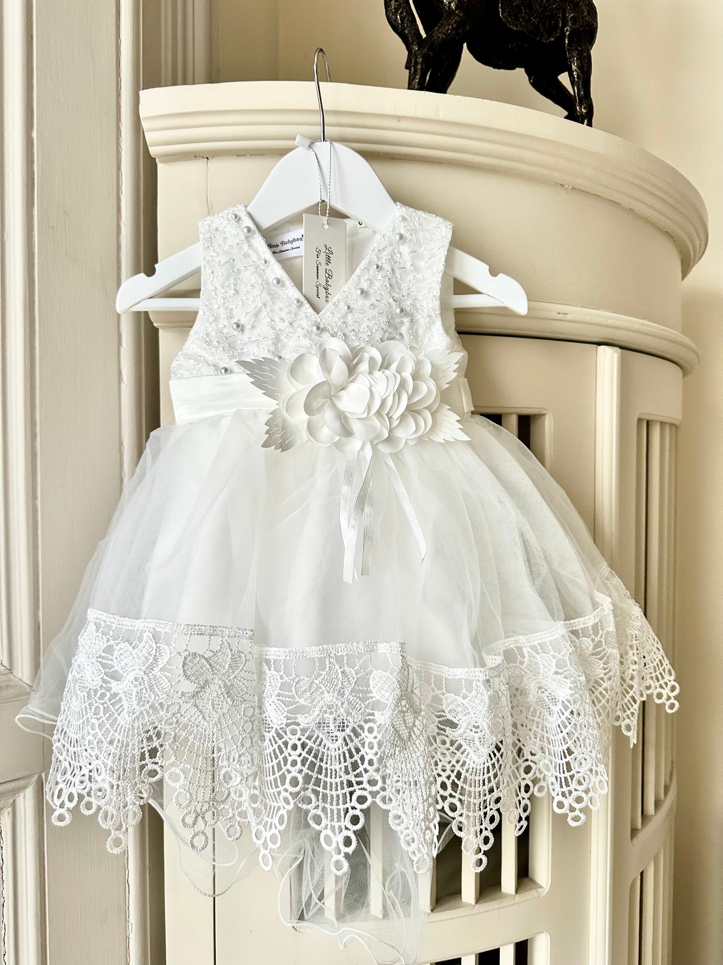 Ivory white lace flower girl dress with intricate lace detail by Little Babybox.
