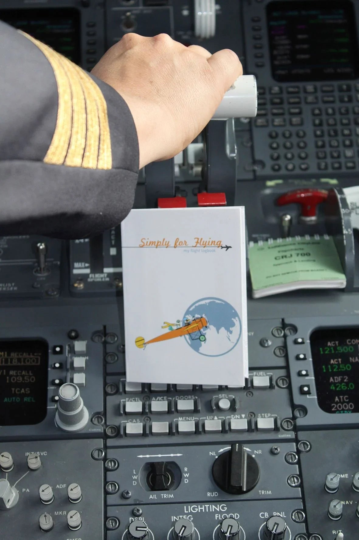 A close up of the Simply for Flying Logbook in cock pit- Little Babybox