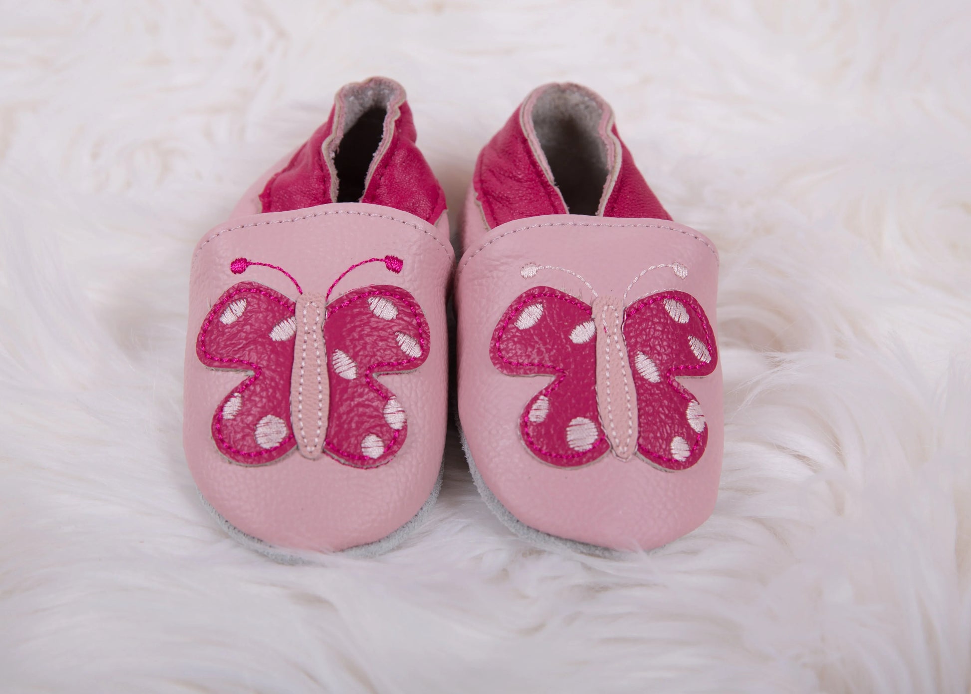Close up of butterfly detail on Pink Butterfly pre-walker baby shoes - Little Babybox